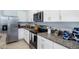 Modern kitchen with stainless steel appliances and granite countertops at 1502 Isleta Loop, Kissimmee, FL 34741
