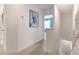 Upstairs hallway with carpet, artwork, and staircase at 1502 Isleta Loop, Kissimmee, FL 34741
