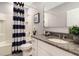Bathroom with tub, shower, and granite countertop at 1502 Isleta Loop, Kissimmee, FL 34741