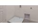 Simple laundry room with a drain and utility access at 1502 Isleta Loop, Kissimmee, FL 34741