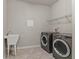 Laundry room with washer, dryer, and utility sink at 556 Keyhold Loop, Apopka, FL 32712