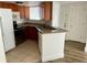 Condo kitchen features granite countertops and modern appliances at 1964 Lake Atriums Cir # 171, Orlando, FL 32839