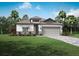 One-story home with gray roof and landscaping at 1681 Andover Ridge Dr, Deland, FL 32720