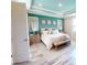 Spacious main bedroom with teal accent wall and ample natural light at 1681 Andover Ridge Dr, Deland, FL 32720