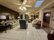 Living room with tiled floors, comfortable seating, and a ceiling fan at 7104 Scruboak Ln, Orlando, FL 32818