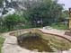 Kidney shaped pool needing attention at 7104 Scruboak Ln, Orlando, FL 32818