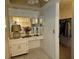 Bathroom with vanity, mirror, and access to a closet at 7104 Scruboak Ln, Orlando, FL 32818