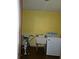 Laundry room with washer, dryer, and utility sink at 7104 Scruboak Ln, Orlando, FL 32818