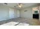 Spacious bedroom with carpet flooring and access to bathroom at 301 Primrose Dr, Davenport, FL 33837