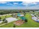 Aerial view of community pool, playground, and pond at 301 Primrose Dr, Davenport, FL 33837
