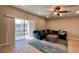 Spacious living room with a large sectional sofa, sliding glass doors, and tile floors at 301 Primrose Dr, Davenport, FL 33837