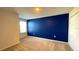 Bedroom with blue accent wall and carpet flooring at 301 Primrose Dr, Davenport, FL 33837