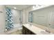 Bathroom with double vanity and a tub shower combo at 301 Primrose Dr, Davenport, FL 33837