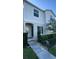Two-story house with light gray siding, green shutters, and a walkway at 301 Primrose Dr, Davenport, FL 33837