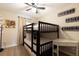 Bedroom with bunk beds, desk, and themed decor at 7596 Assembly Ln, Kissimmee, FL 34747