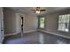 Bright bedroom with tile floors and access to bathroom at 4115 Swamp Deer Rd, New Smyrna Beach, FL 32168