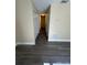 Hallway with neutral walls and wood-look flooring at 641 Bayport Dr, Kissimmee, FL 34758