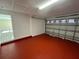 Clean and spacious garage with painted floor and open garage door at 641 Bayport Dr, Kissimmee, FL 34758