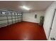Garage with painted floor, water heater, and storage space at 641 Bayport Dr, Kissimmee, FL 34758