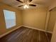 Bedroom with ceiling fan and wood-look floors at 641 Bayport Dr, Kissimmee, FL 34758
