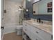 Modern bathroom with white vanity and blue shiplap walls at 11209 Crescent Bay Blvd, Clermont, FL 34711