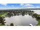 Aerial view of lakefront community with various houses at 11209 Crescent Bay Blvd, Clermont, FL 34711