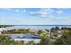 Aerial view of a serene lakefront park with walking paths and a gazebo at 11209 Crescent Bay Blvd, Clermont, FL 34711