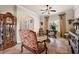 Spacious living room with seating area and large windows at 212 Crestrun Loop, Leesburg, FL 34748