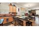 Eat-in kitchen with granite counters, breakfast bar, and view to Gathering room at 212 Crestrun Loop, Leesburg, FL 34748