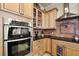 Kitchen boasts double ovens and granite countertops at 212 Crestrun Loop, Leesburg, FL 34748