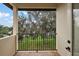 Balcony offering backyard and treetop views at 212 Crestrun Loop, Leesburg, FL 34748