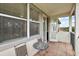 Private balcony with table and chairs, offering scenic views at 212 Crestrun Loop, Leesburg, FL 34748