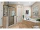 Bathroom features a large soaking tub and walk-in shower at 212 Crestrun Loop, Leesburg, FL 34748