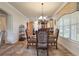 Formal dining room with ornate chairs and glass-top table at 212 Crestrun Loop, Leesburg, FL 34748