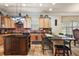 Spacious kitchen with granite countertops, stainless steel appliances, and an island at 212 Crestrun Loop, Leesburg, FL 34748