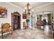Elegant dining room with chandelier and wine cellar at 212 Crestrun Loop, Leesburg, FL 34748