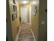 Simple hallway with wood-look floors and neutral walls at 2939 Falling Tree Cir, Orlando, FL 32837