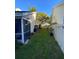 Side yard with grassy area and privacy fence at 2939 Falling Tree Cir, Orlando, FL 32837