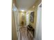 Hallway with wood-look floors and decorative accents at 2939 Falling Tree Cir, Orlando, FL 32837