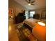 Main bedroom with wood floors and access to patio at 2939 Falling Tree Cir, Orlando, FL 32837