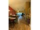 Open living room with wood floors and a fireplace at 2939 Falling Tree Cir, Orlando, FL 32837