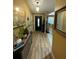 Bright and spacious entryway with wood-look floors at 2939 Falling Tree Cir, Orlando, FL 32837