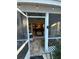 Enclosed patio with view of living and dining areas at 2939 Falling Tree Cir, Orlando, FL 32837