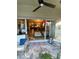 Enclosed patio with tiled floors and view to living area at 2939 Falling Tree Cir, Orlando, FL 32837