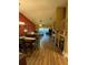 Open living area with hardwood floors, fireplace, and view to backyard at 2939 Falling Tree Cir, Orlando, FL 32837