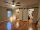 Spacious bedroom with hardwood floors and large walk-in closet at 14902 Arrena Rd, Winter Garden, FL 34787