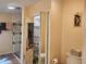 Bathroom with a walk-in shower and mirrored storage at 14902 Arrena Rd, Winter Garden, FL 34787