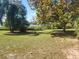 Tranquil backyard setting showcasing a picturesque lake view at 14902 Arrena Rd, Winter Garden, FL 34787