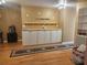 Finished basement with built-in cabinetry and hardwood floors at 14902 Arrena Rd, Winter Garden, FL 34787