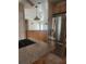 Kitchen with stainless steel appliances and granite countertops at 14902 Arrena Rd, Winter Garden, FL 34787